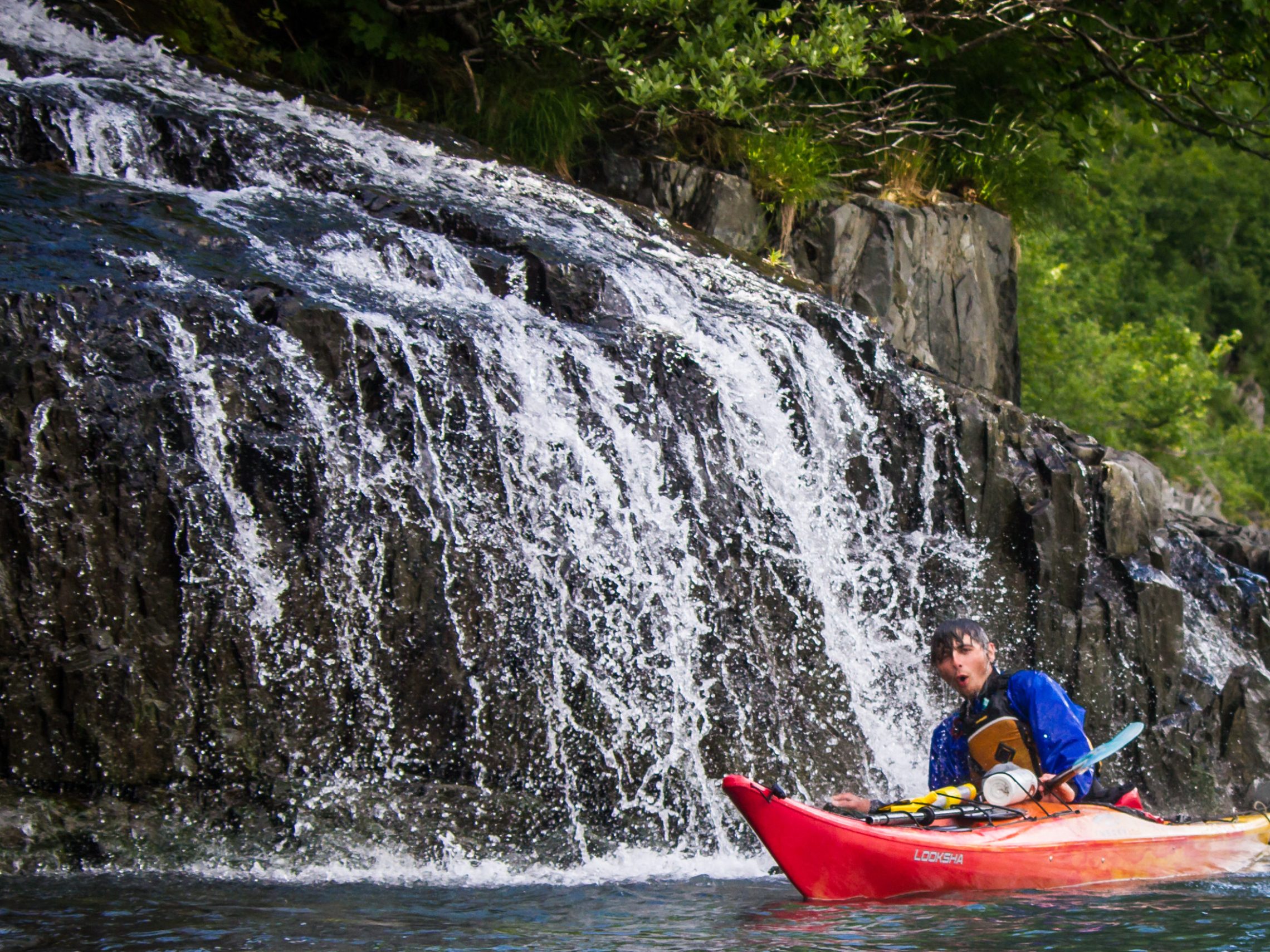 Kayaking through a waterfall, Seward, AK