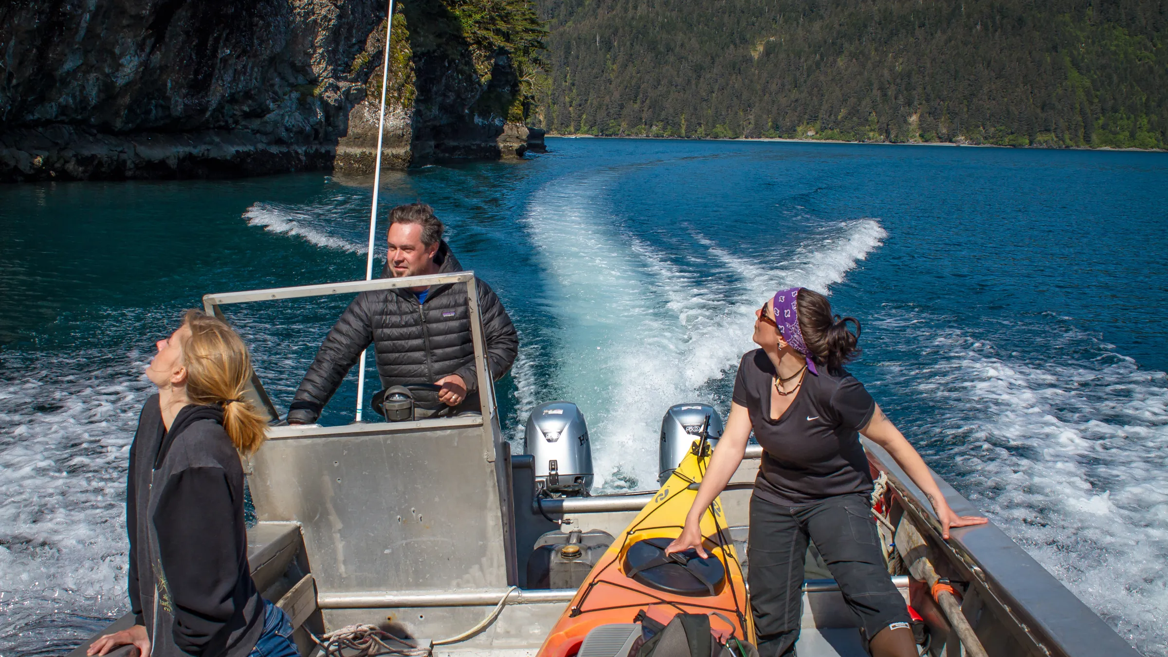Capt. Tom Miller helming the water taxi to Thumb Cove in the Salty, Seward, AK