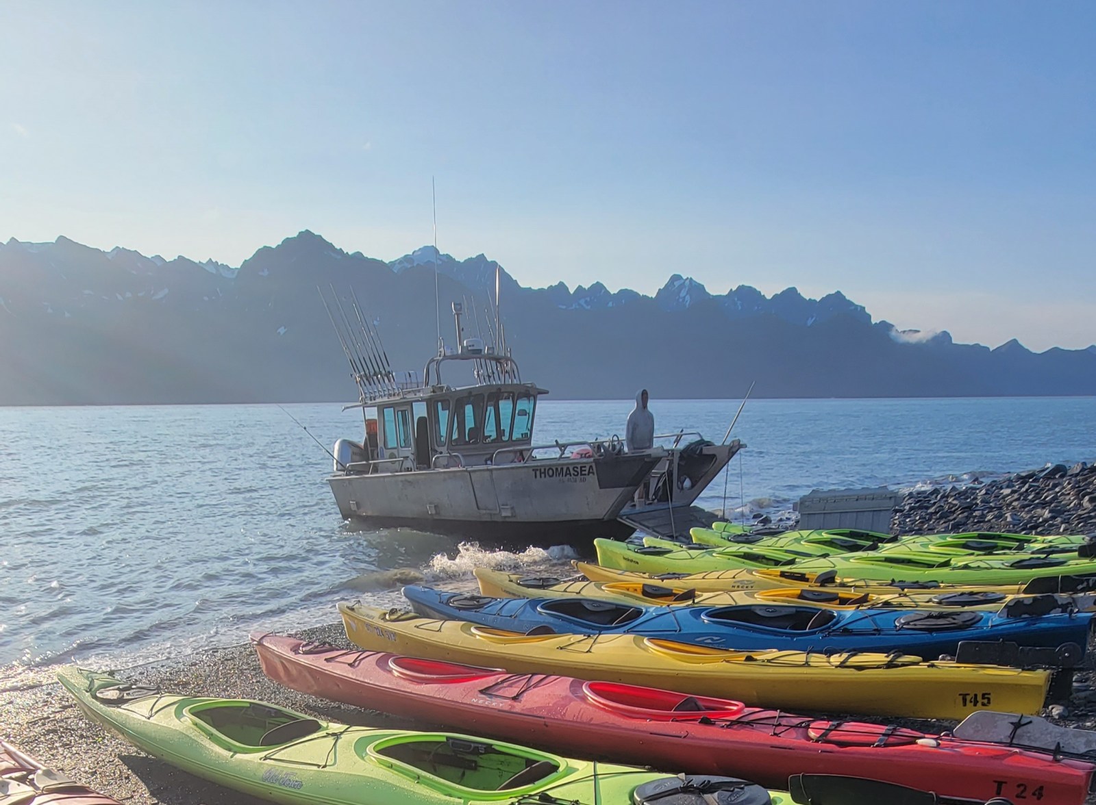 a boat sitting next to a body of water
