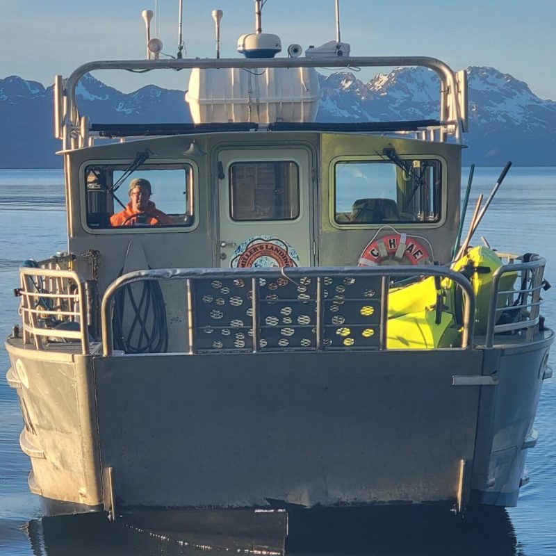 a small boat in a large body of water