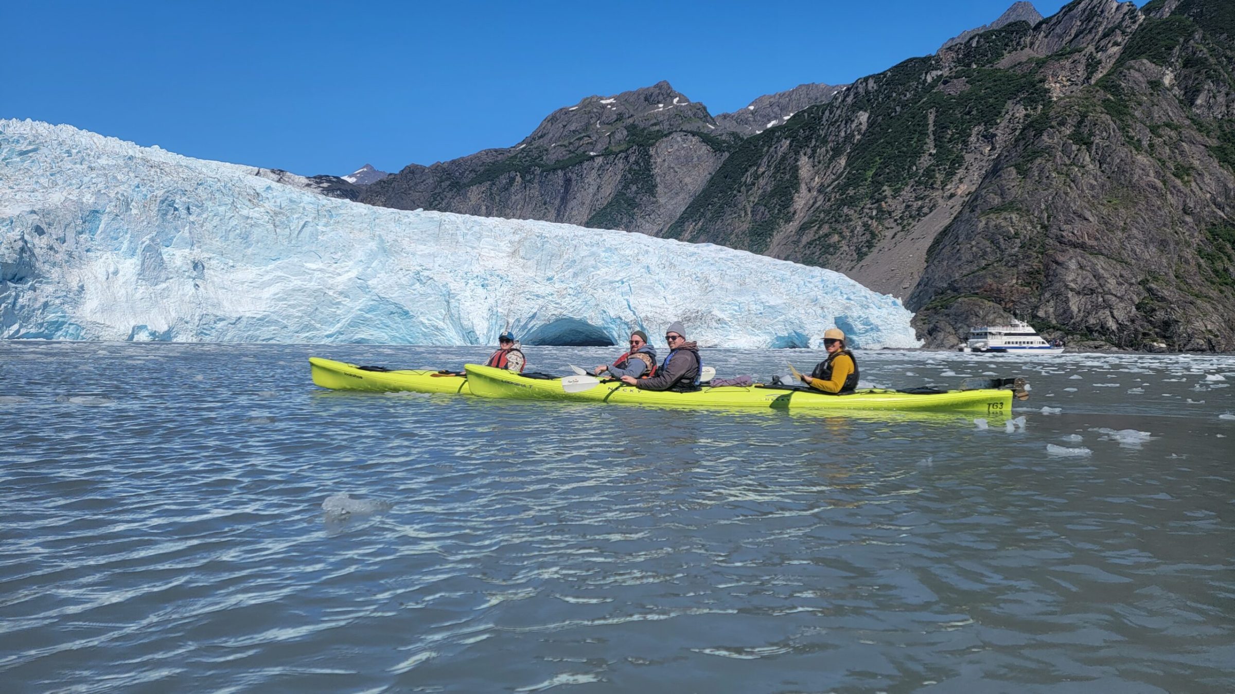 a group of people on a raft in a body of water