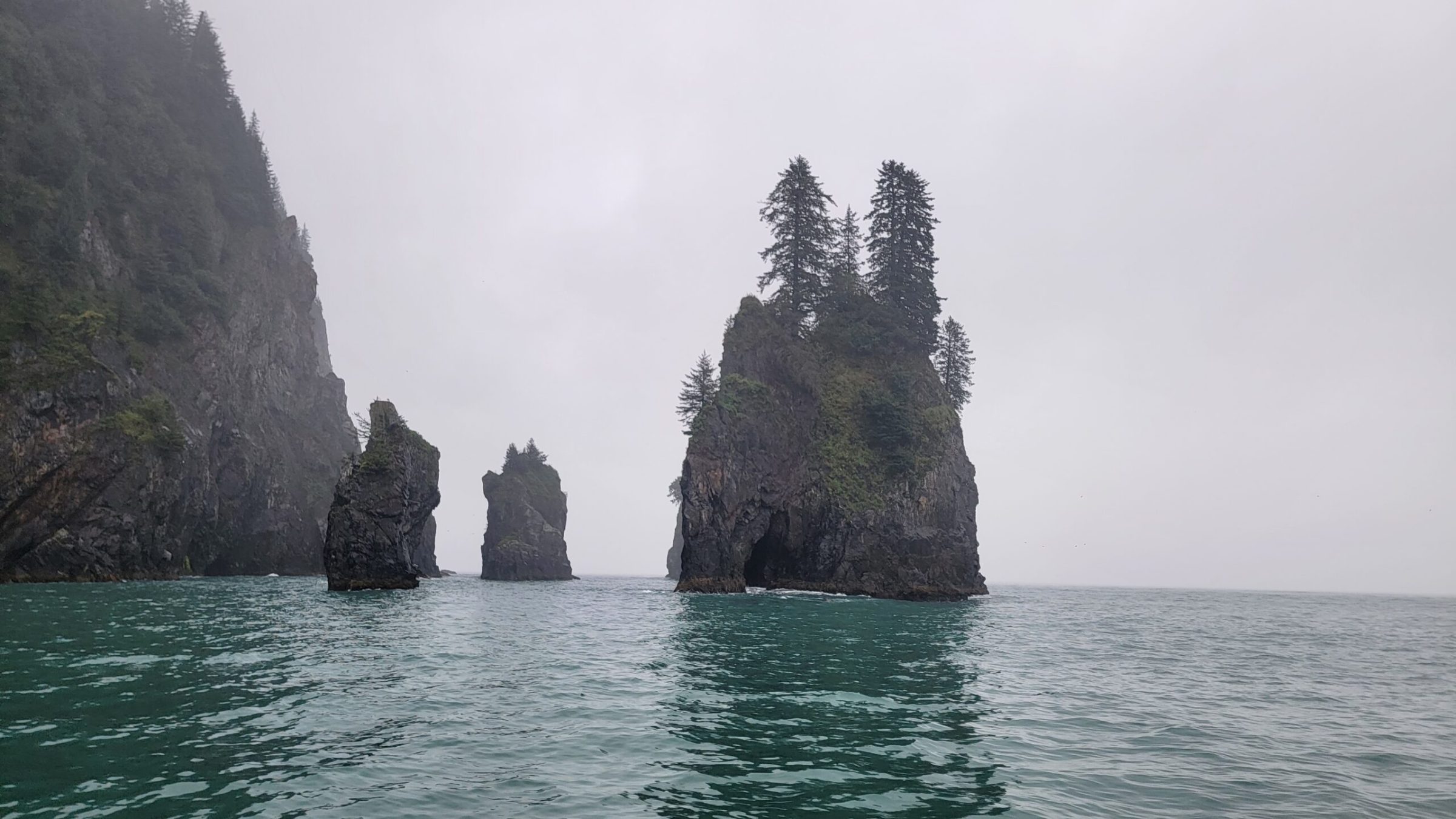 a large body of water with a mountain in the middle of a lake