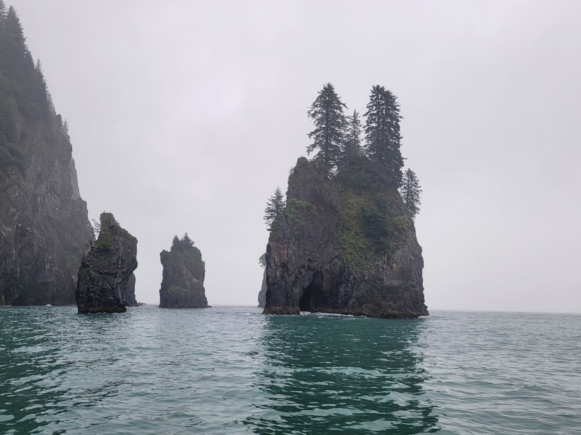 a large body of water with a mountain in the middle of a lake