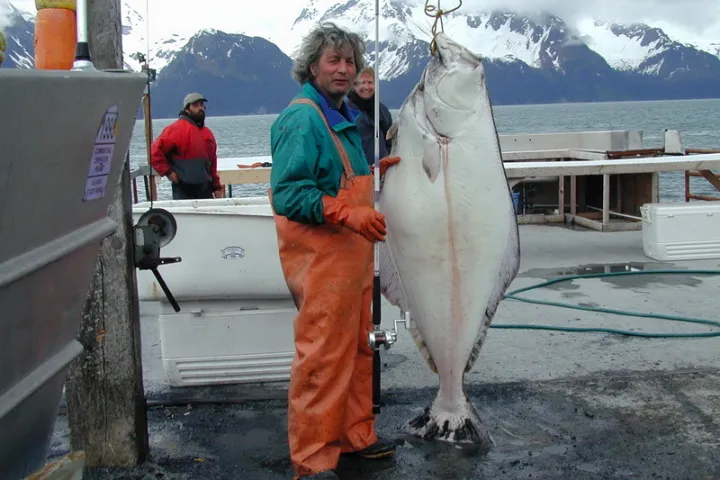 a man holding a fish