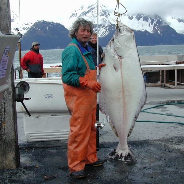 a man holding a fish