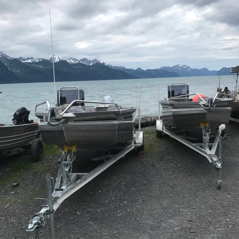 a boat that is sitting on a dock next to a body of water