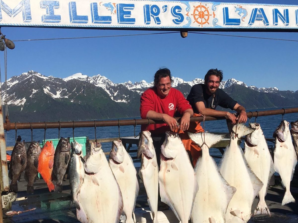 a group of people that are standing in the water