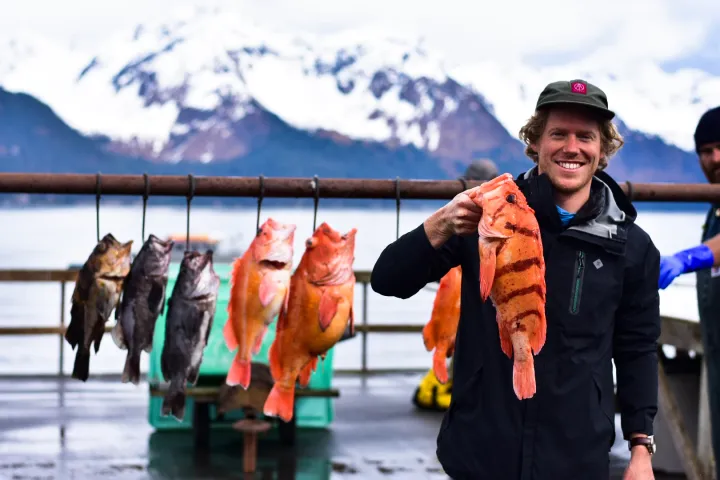 a person holding a fish