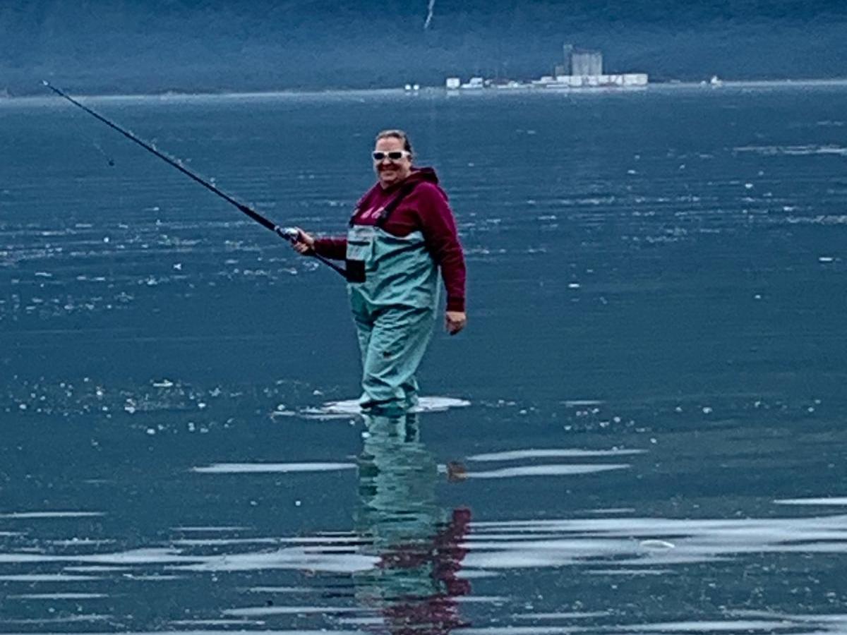 a women in the water fishing