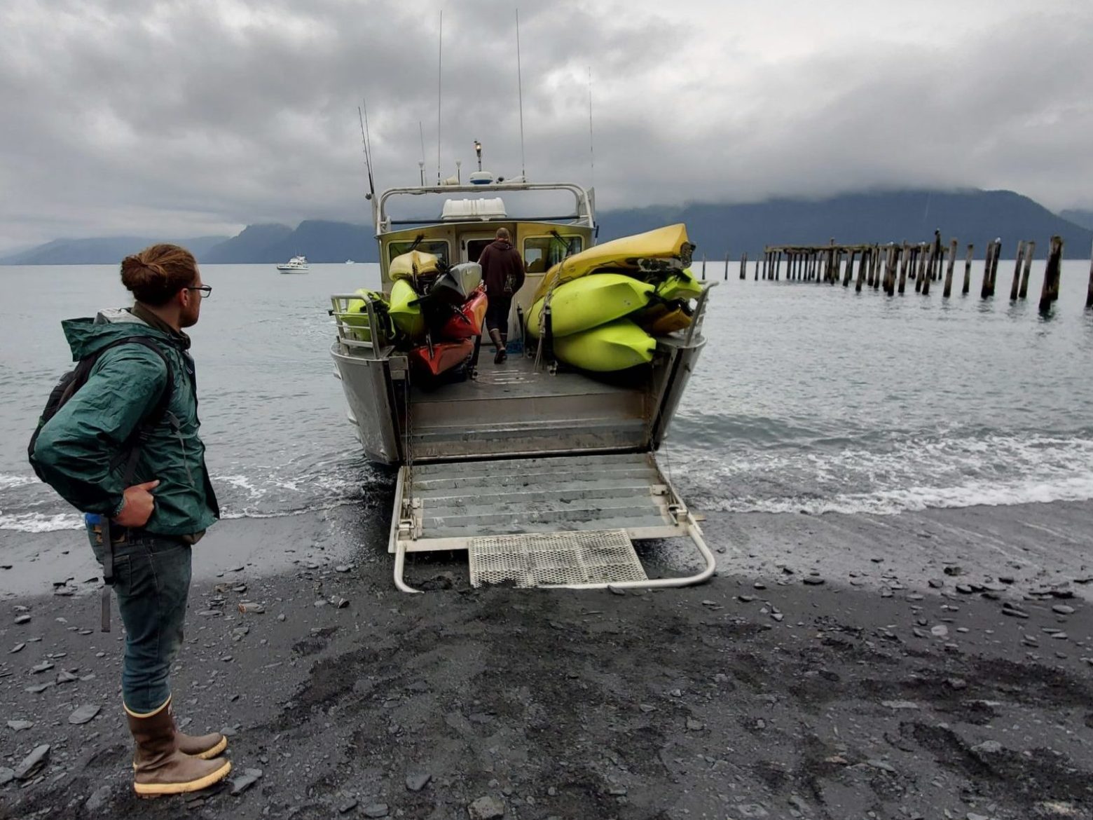 a person standing on top of a sandy beach