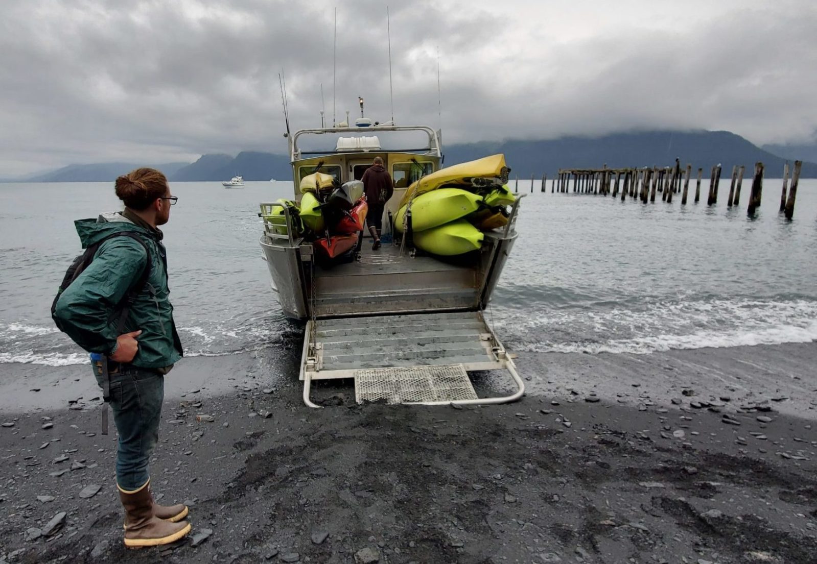 a person standing on top of a sandy beach