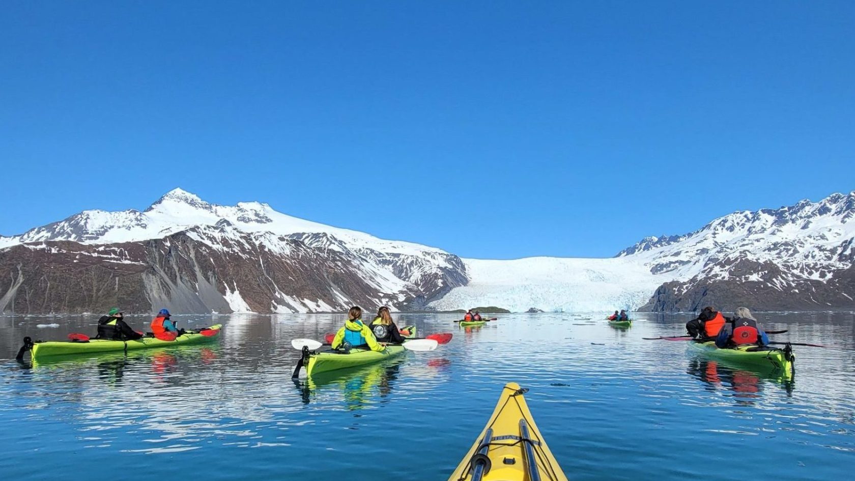 a group of people on a boat in the water