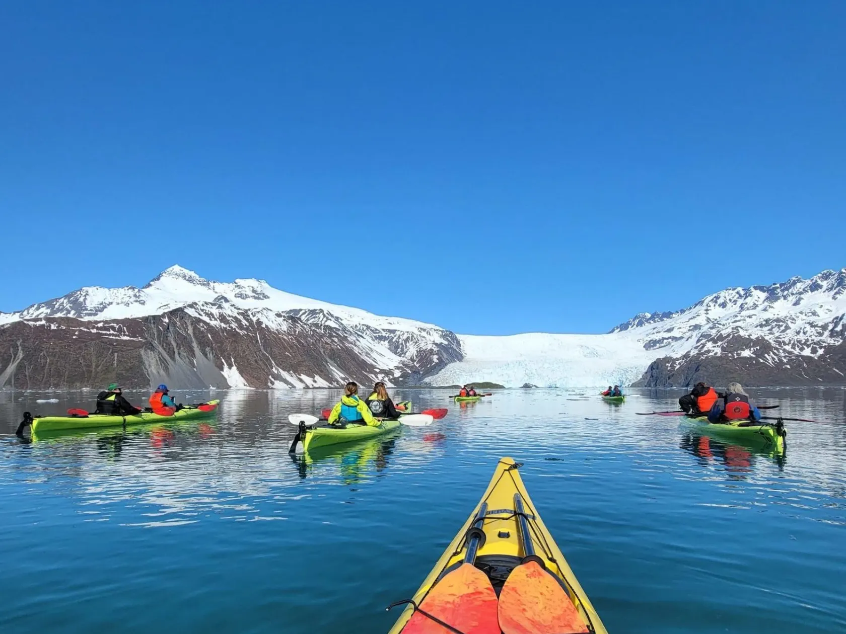 a group of people on a boat in the water