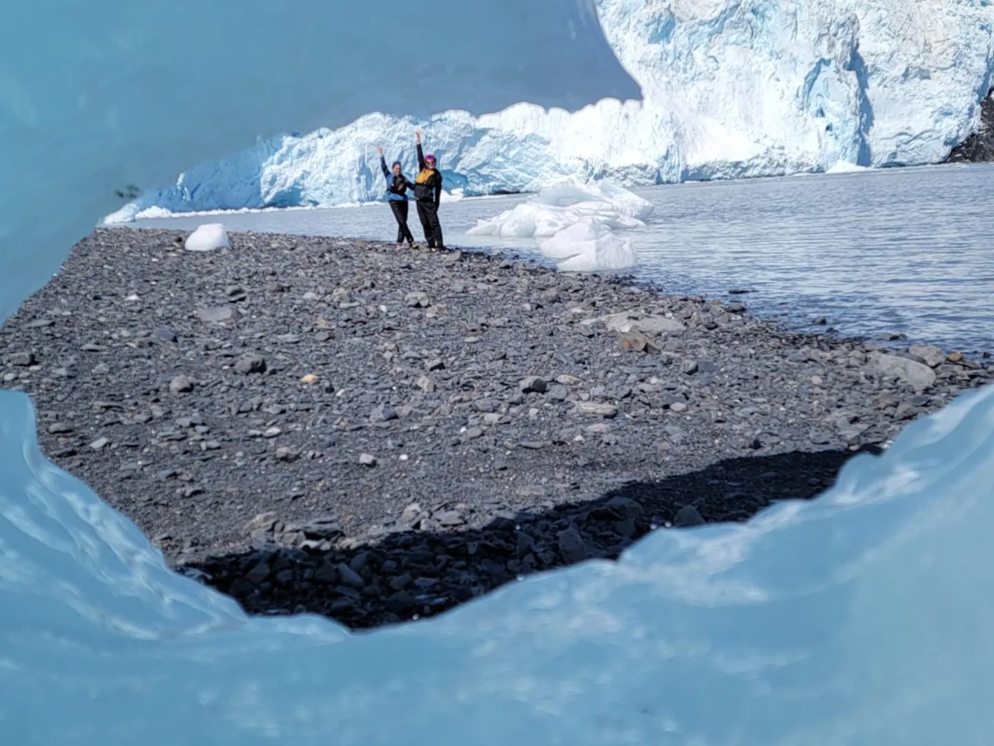 a man riding a surfboard on top of a snow covered mountain
