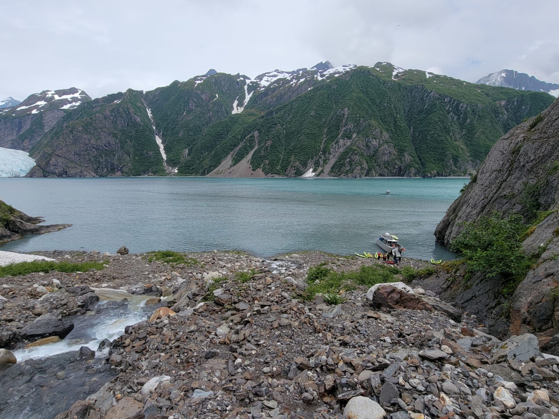 a rocky shore next to a body of water