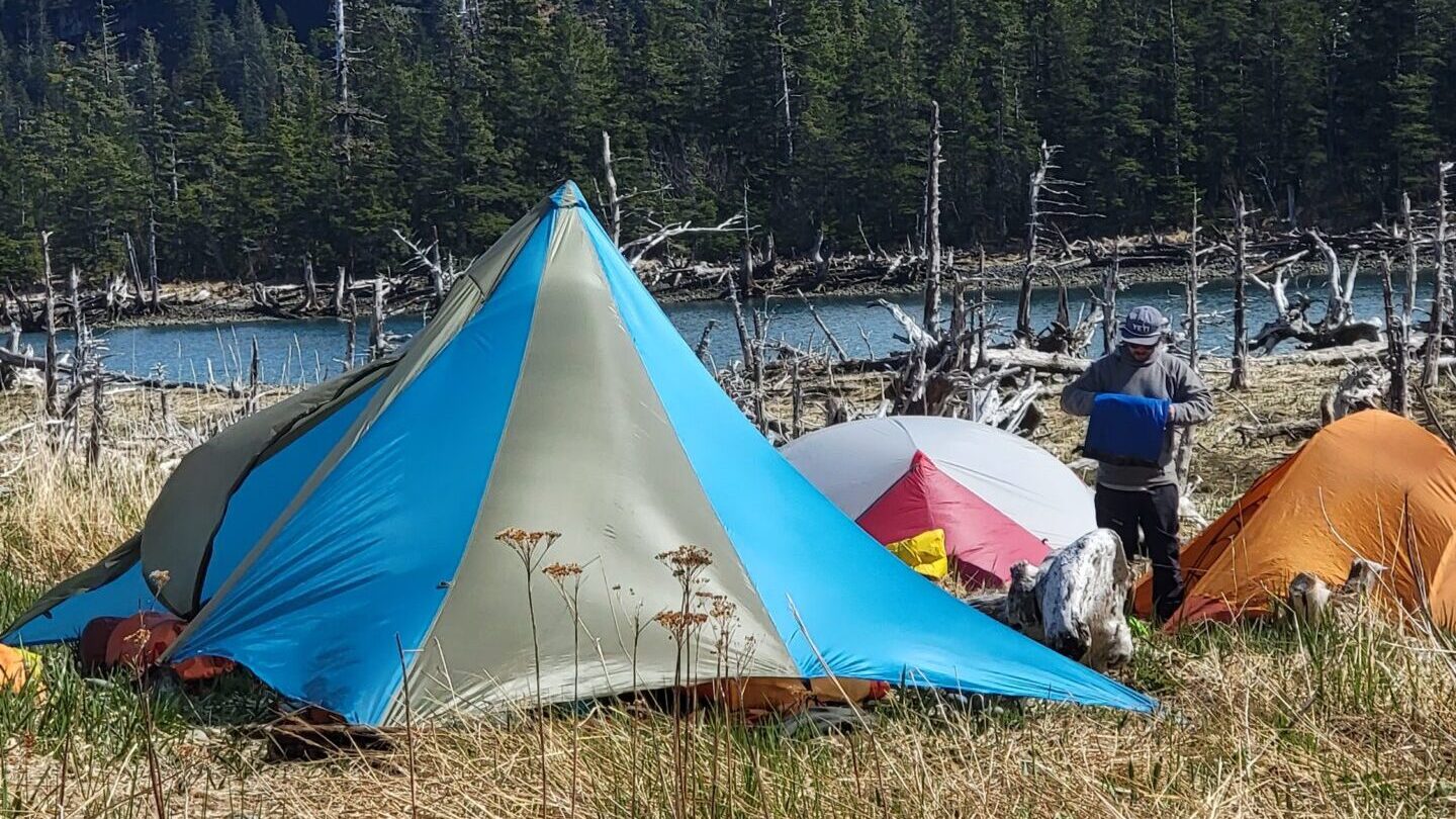 a group of people sitting in a tent