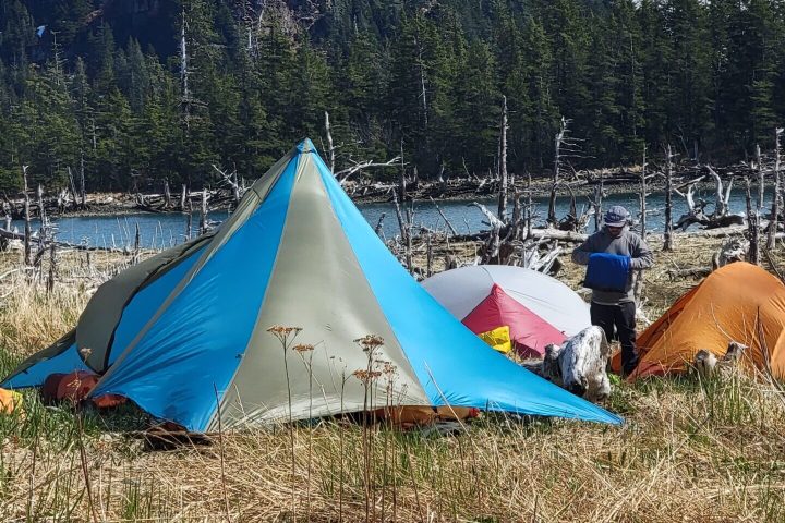 a group of people sitting in a tent