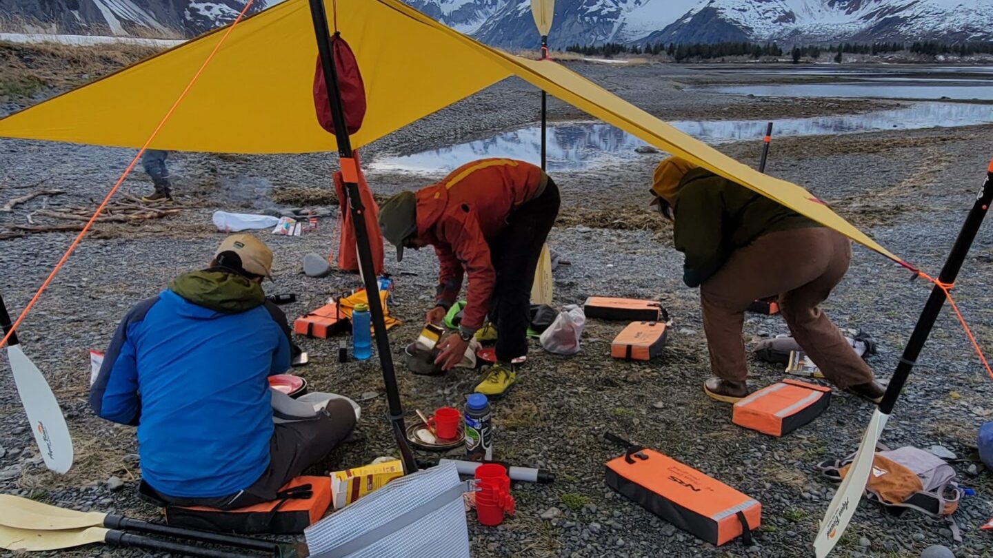 a group of people sitting in a tent