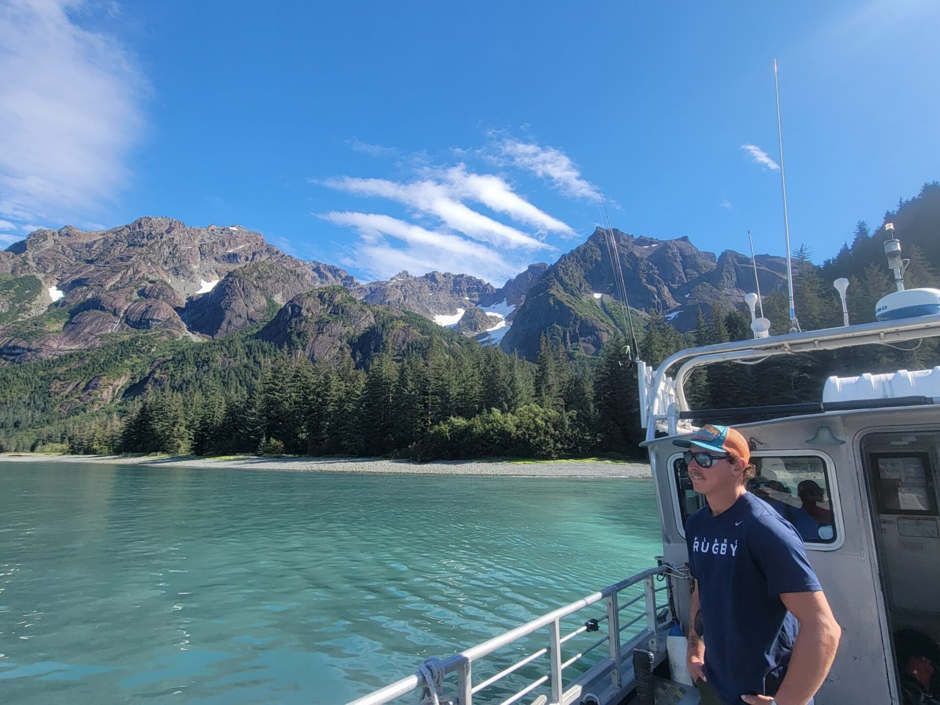 a man standing on a boat in the water