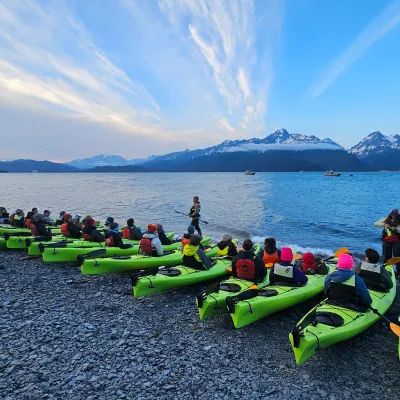 a group of people in a boat on a body of water