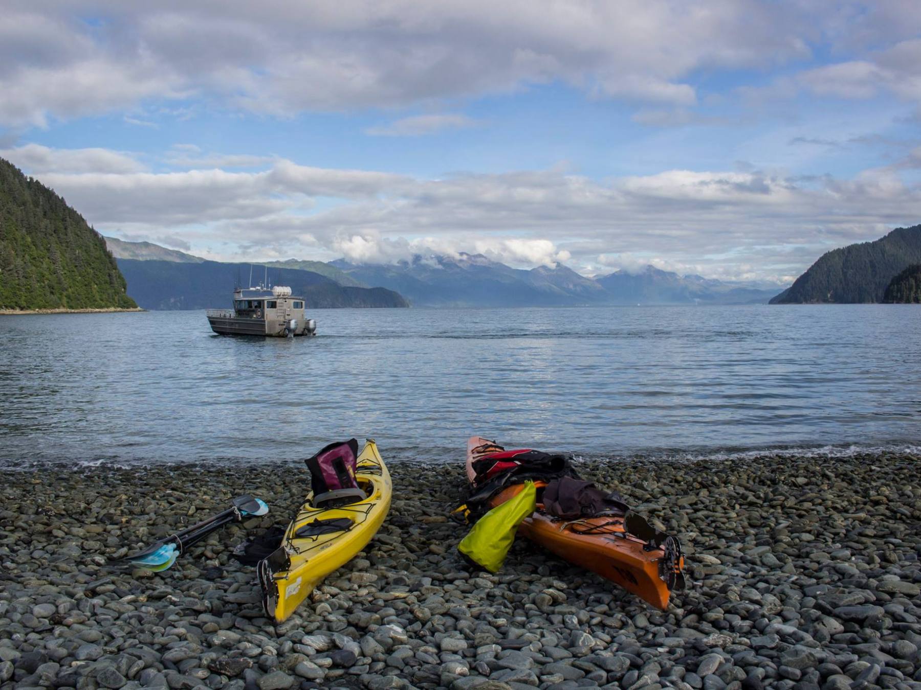 a rocky beach next to a body of water
