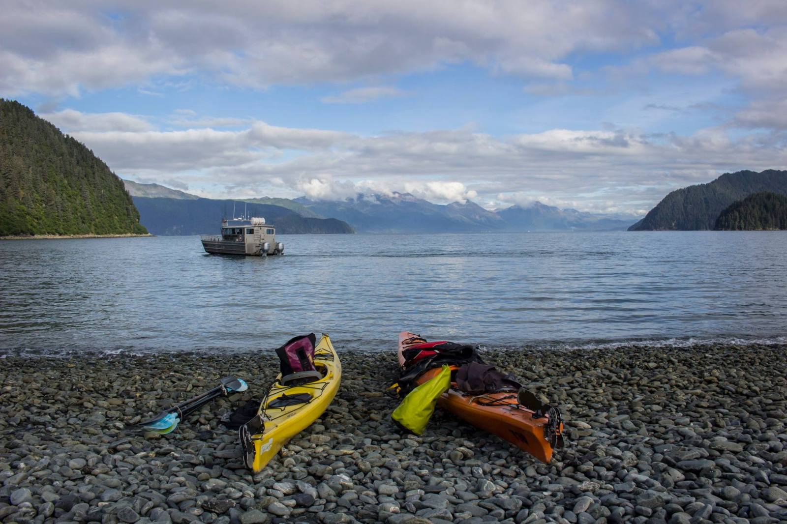 a rocky beach next to a body of water