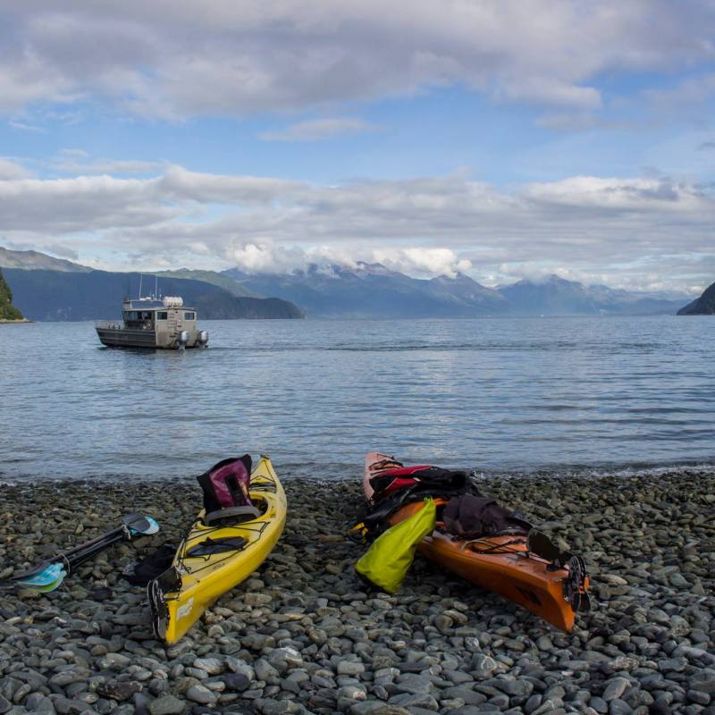 a rocky beach next to a body of water