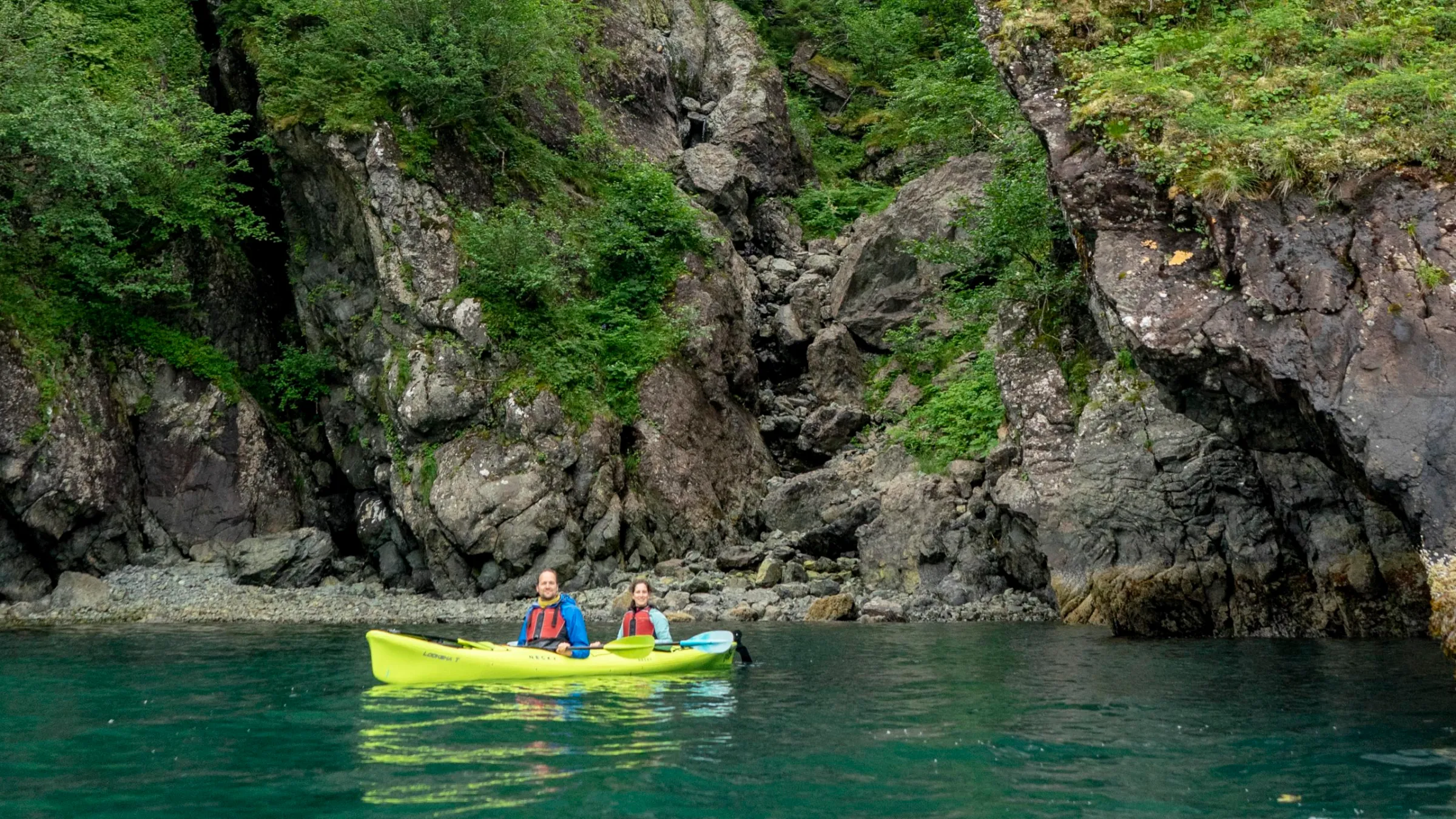 a group of people on a raft in a body of water
