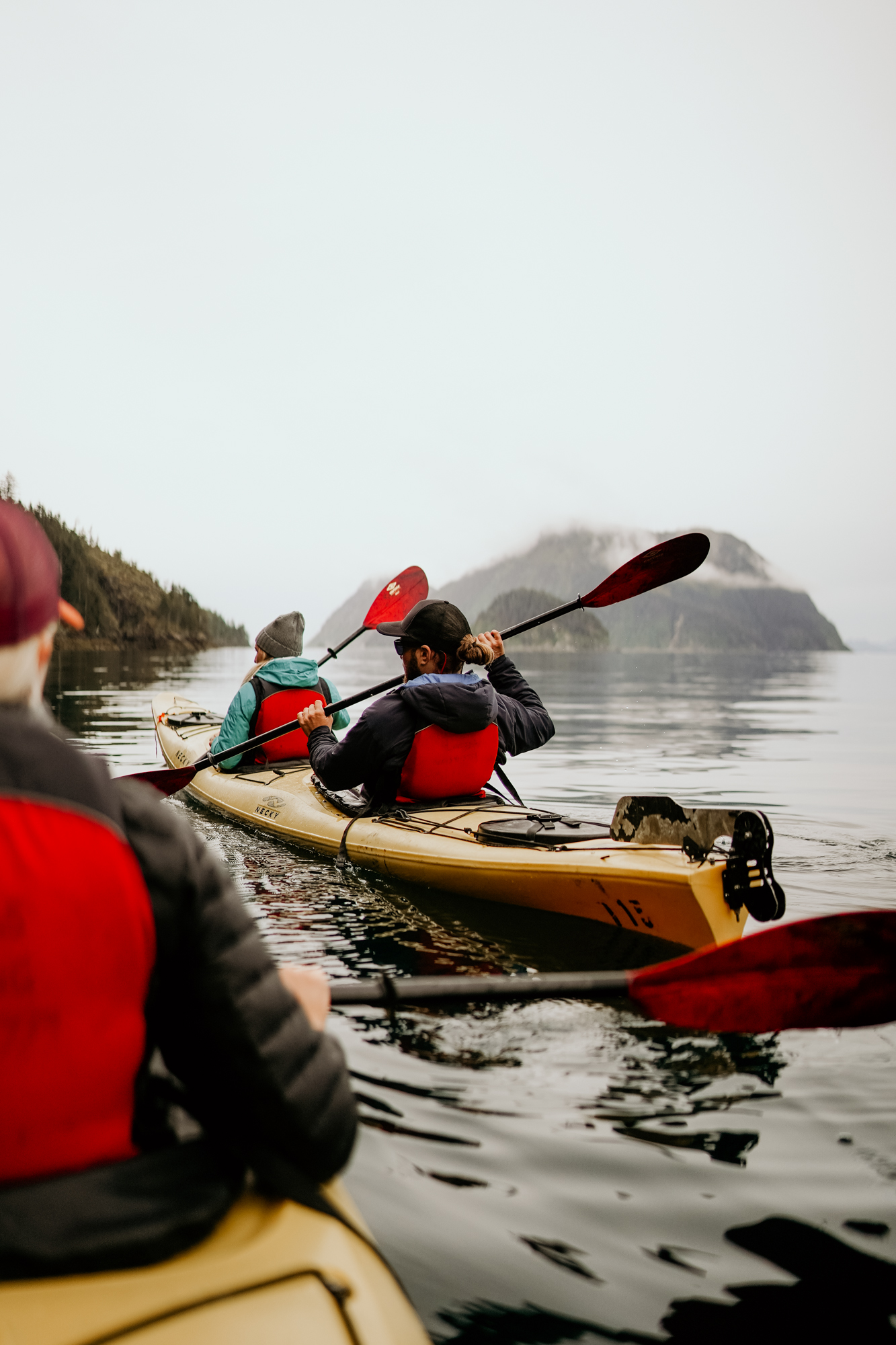 a man sitting in a kayak on a body of water Millers Landing Seward Alaska Beach Seaside