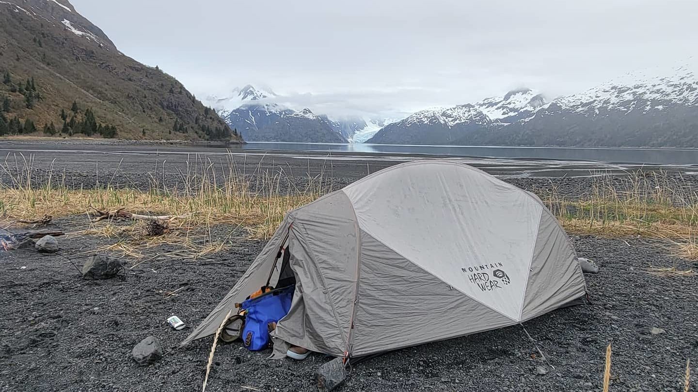 a tent with a mountain in the background