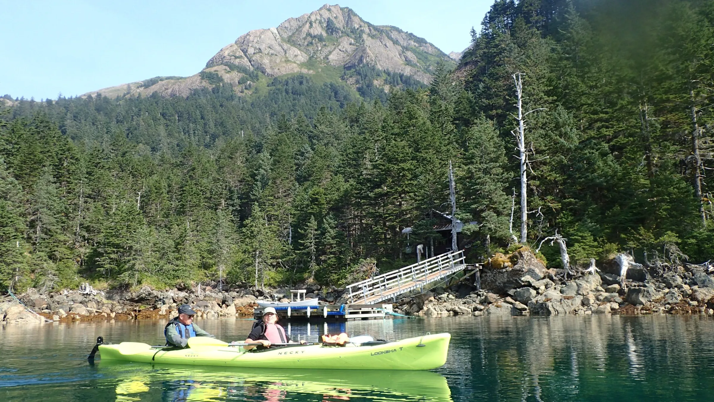 a group of people on a boat in the water