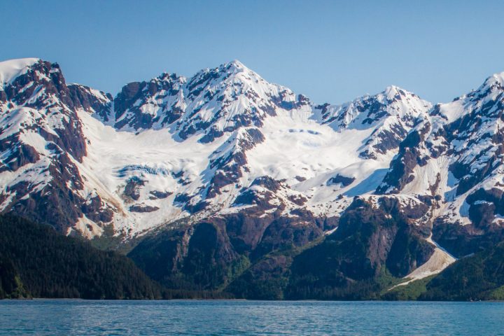a view of water and a mountain in the background