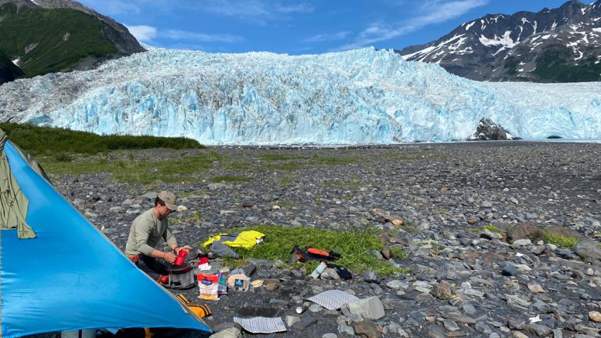 a group of people sitting on top of a mountain