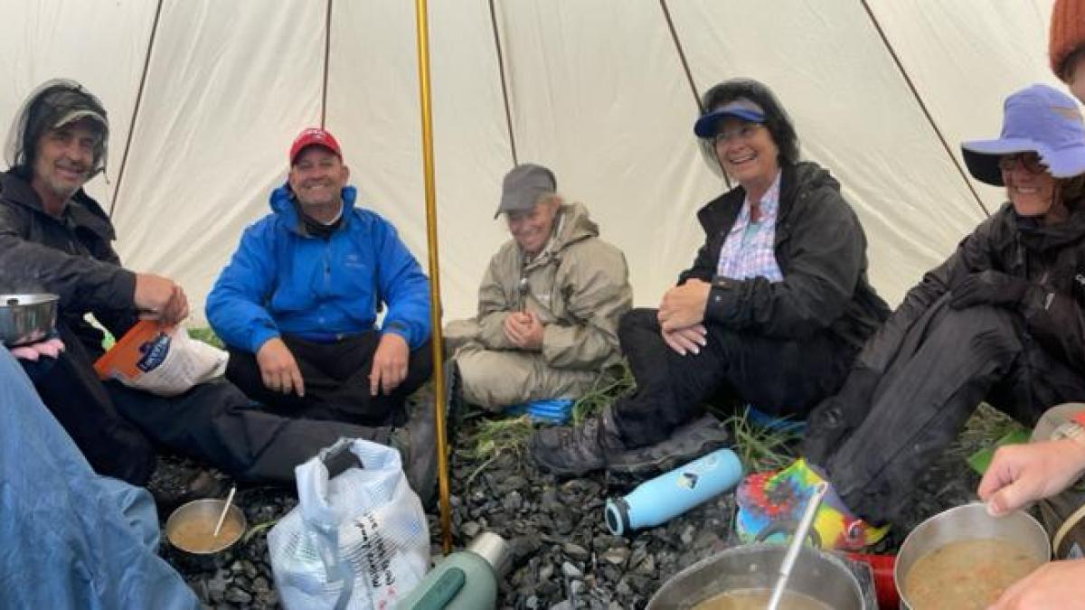 a group of people sitting around a table