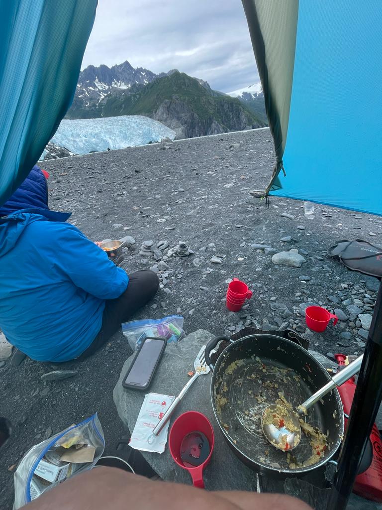 a group of people sitting at a beach
