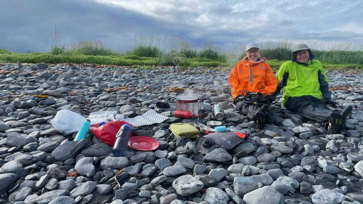 a group of people on a rock