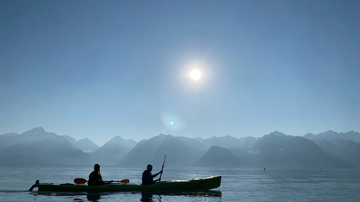 a group of people in a boat on a body of water