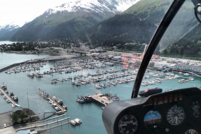 the view over the bay and docks in Seward from a helicopter