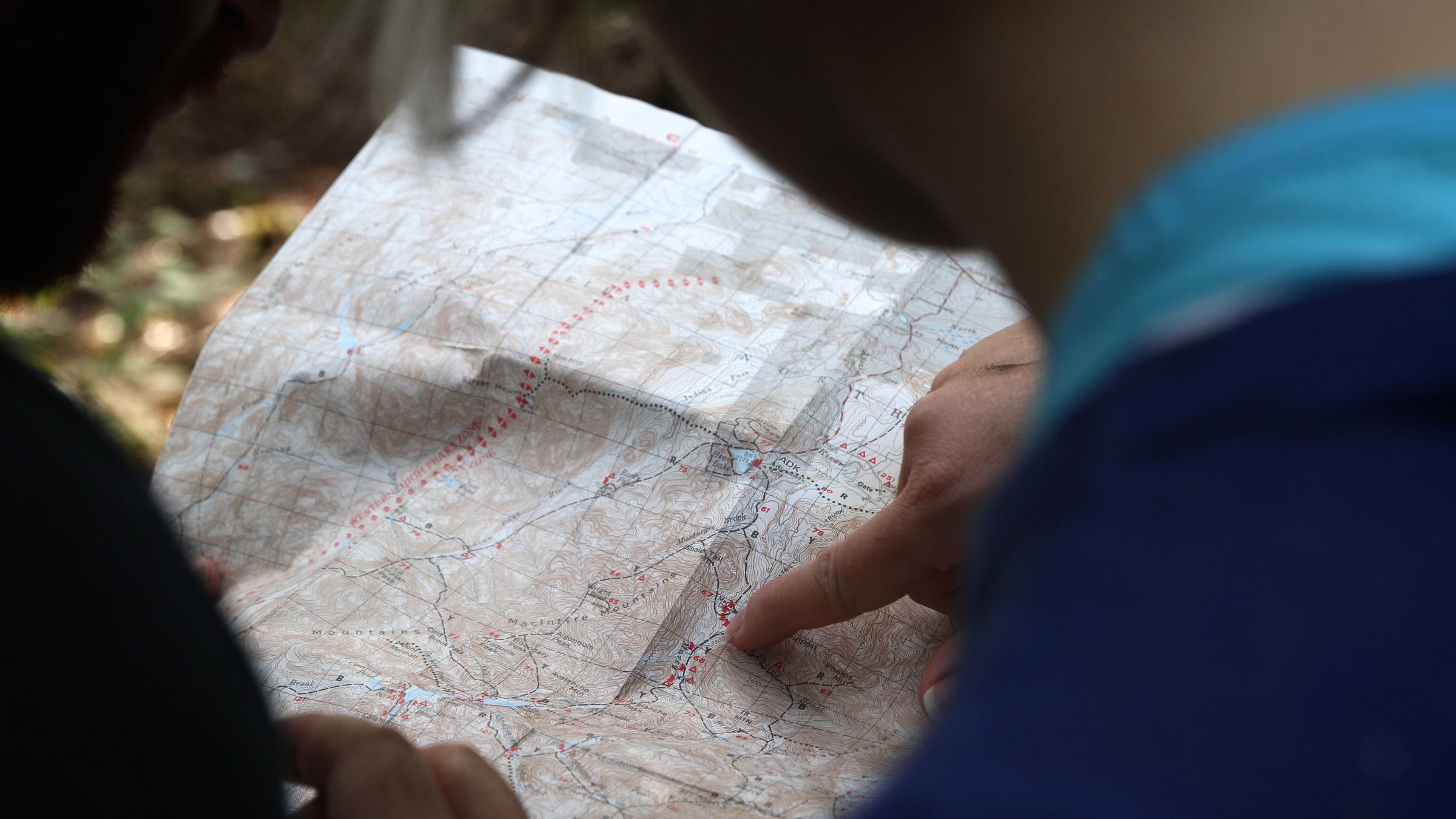 a person reading a topographical map