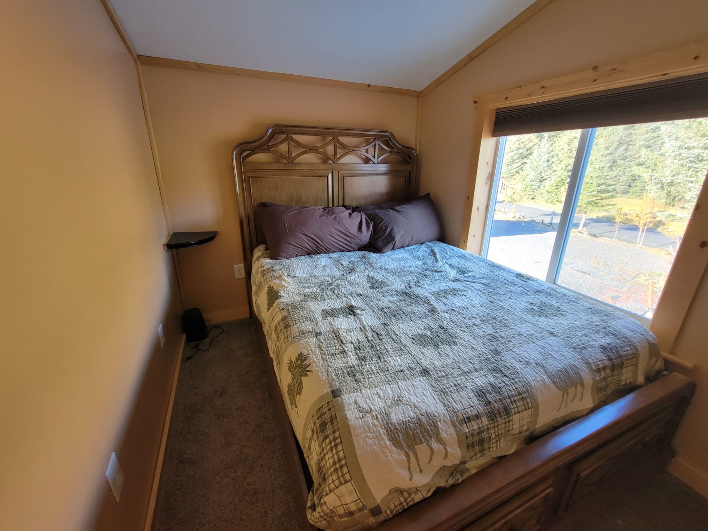 a bedroom with a bed in a room