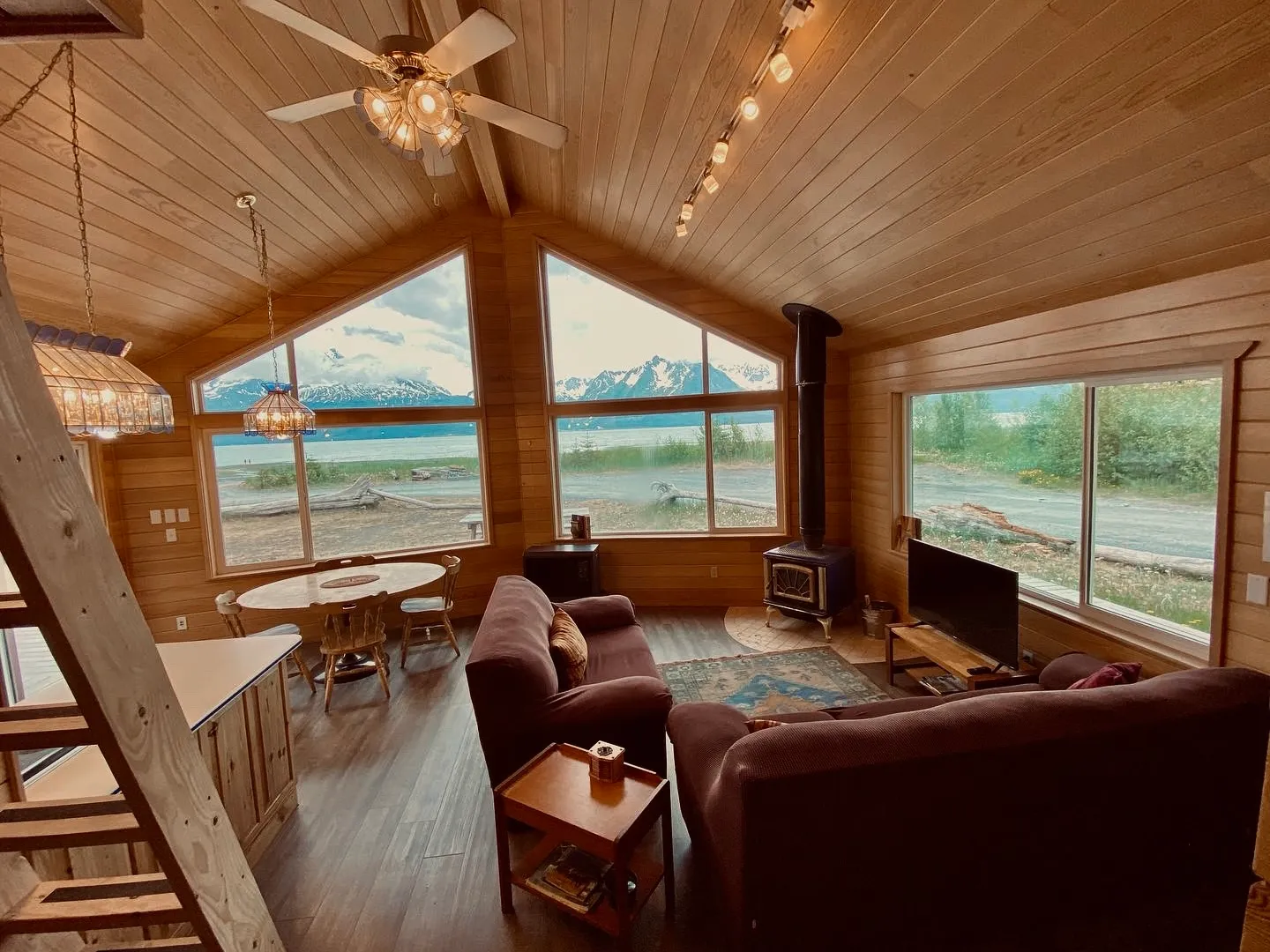 a room filled with furniture and a large window