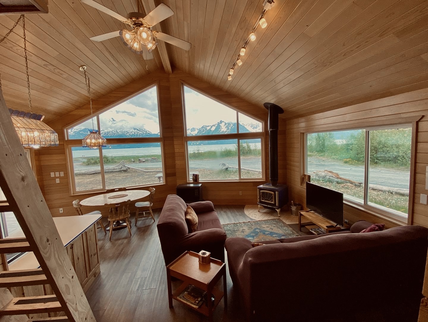 a room filled with furniture and a large window