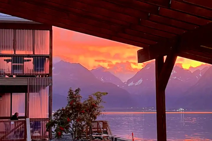 a wooden bench sitting in front of a building