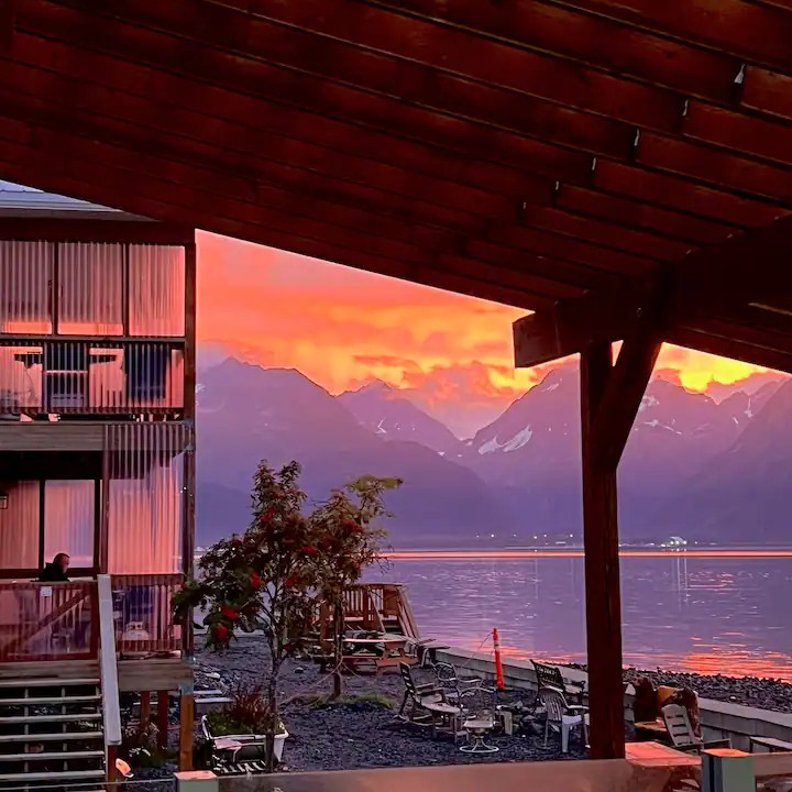 a wooden bench sitting in front of a building