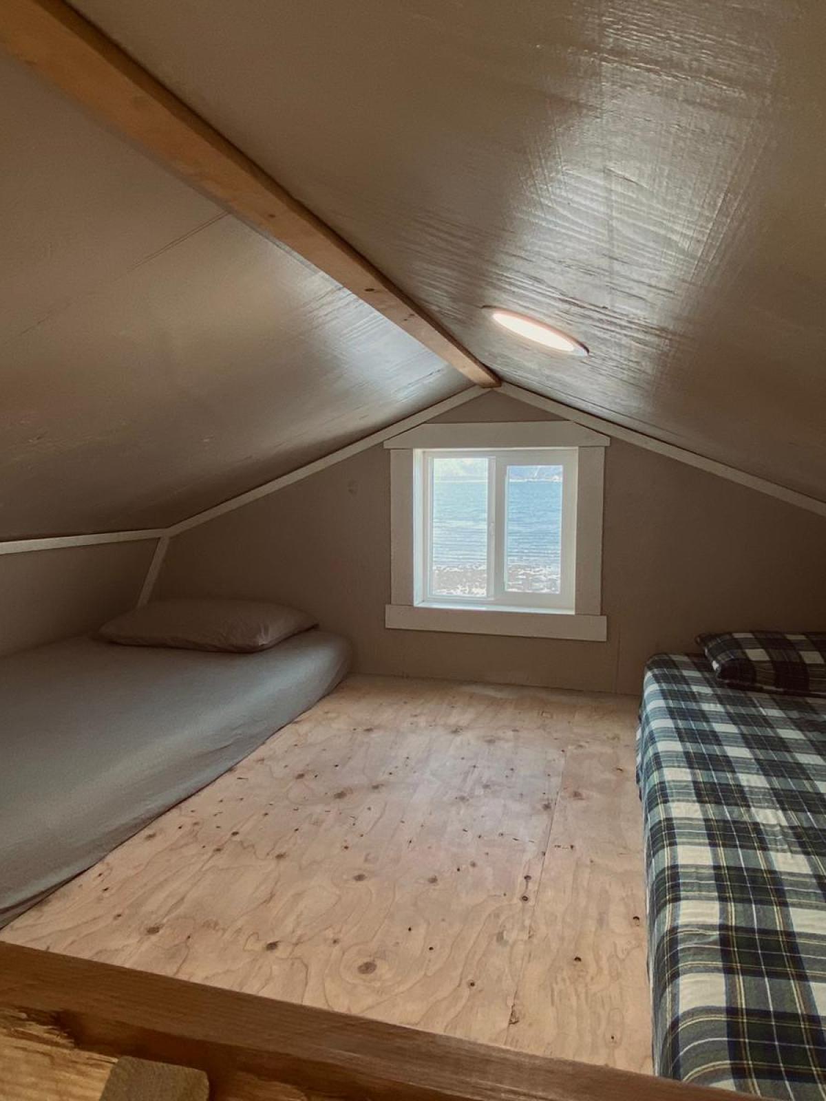 interior Beachfront Millers Landing cabin. detail of the big loft with two twin beds
