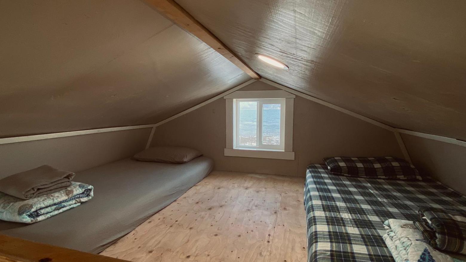 interior Beachfront Millers Landing cabin. detail of the big loft with two twin beds