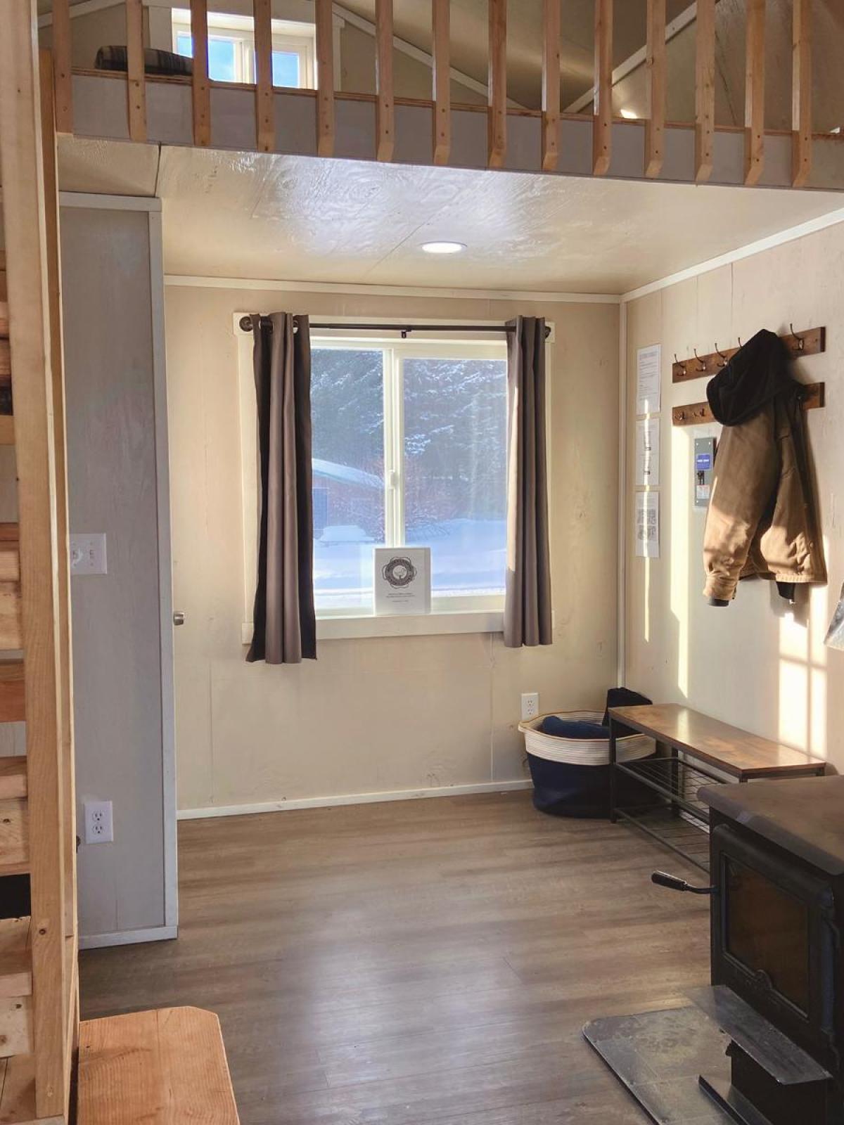 interior Beachfront Millers Landing cabin with stove and ladders