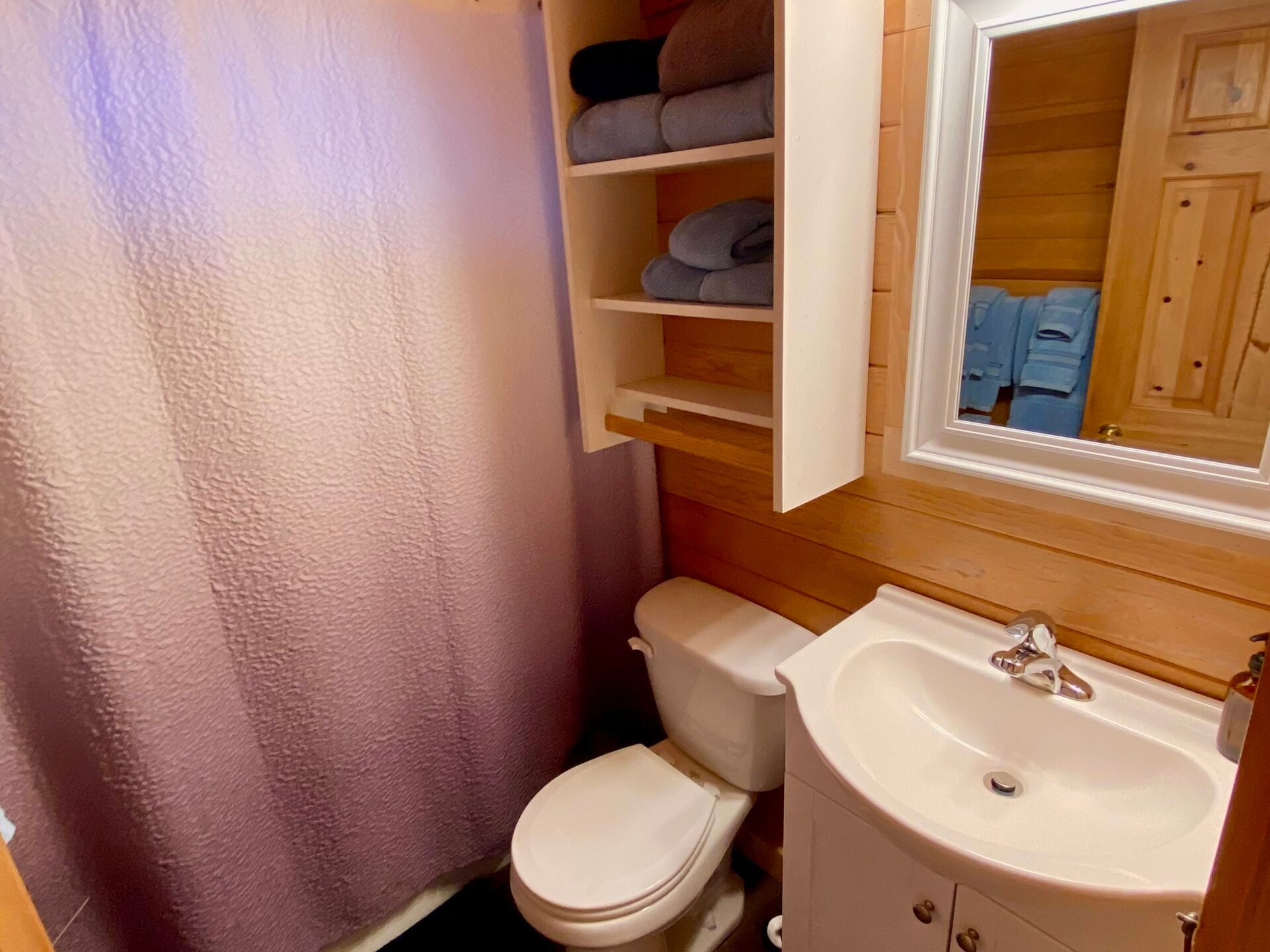 a room with a sink and a mirror