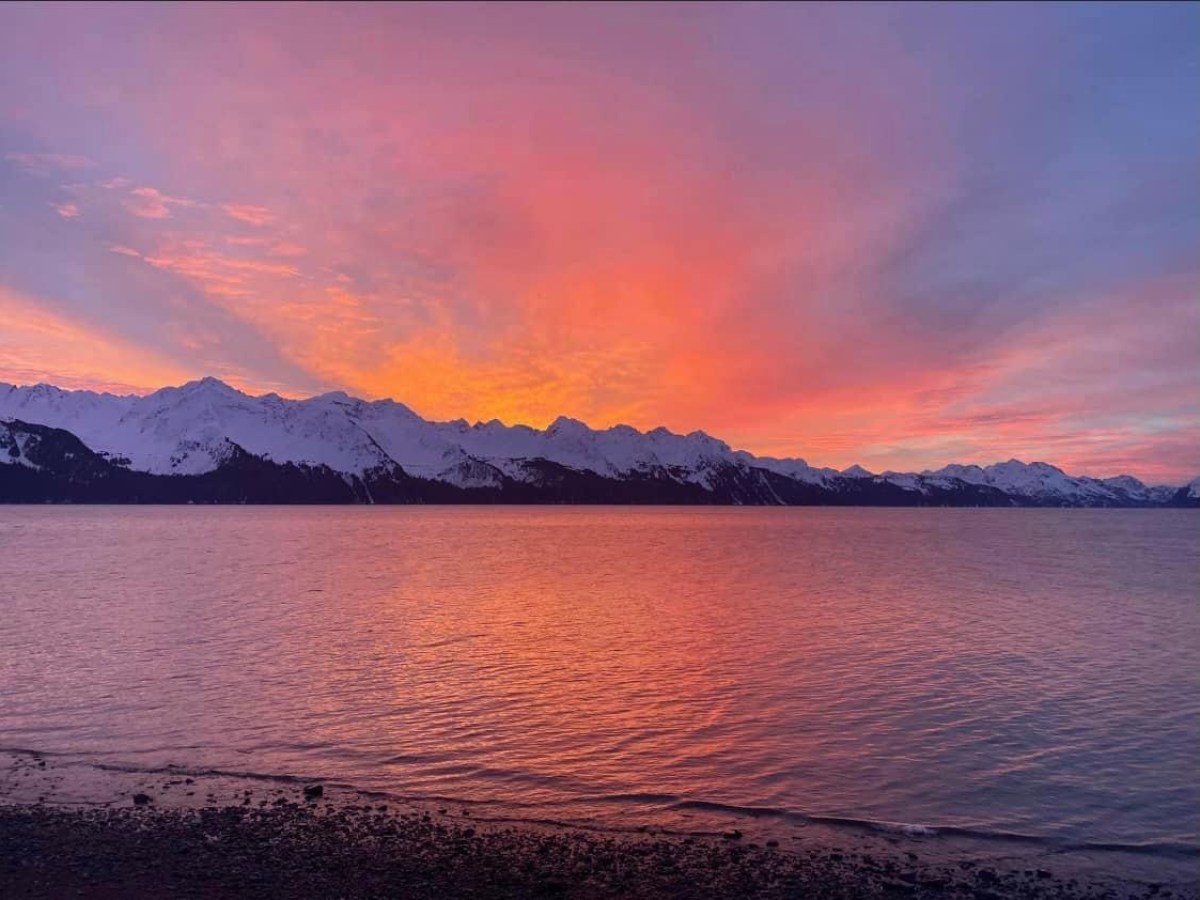 a sunset over a body of water