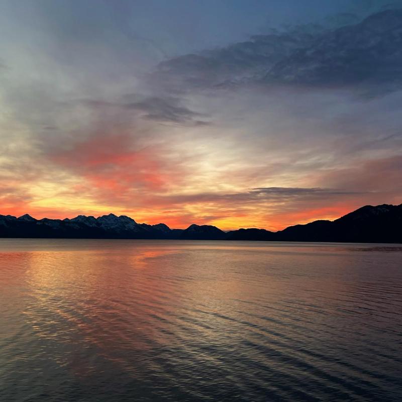 a sunset over a body of water